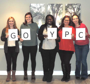 Group holding GO YPC signs
